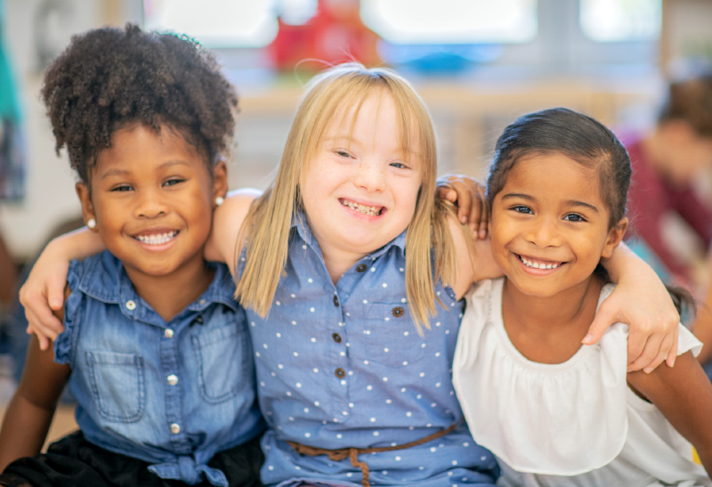 Girls with arms around each other